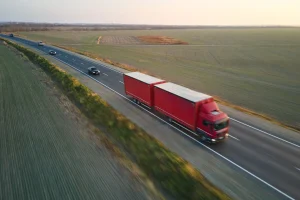 aerial-view-of-blurred-fast-moving-semi-truck-with-2022-06-27-16-09-17-utc